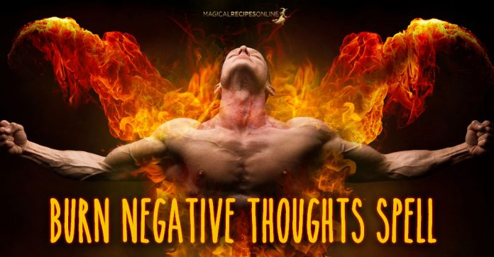 Burn your negative thoughts with this candle spell!