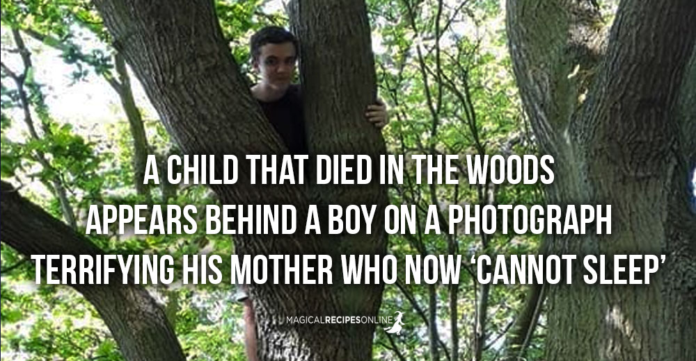 A child that died in the woods appears behind a boy on a photograph!